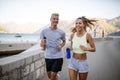 Healthy sporty lifestyle. Happy fit people friends exercising and running outdoor Royalty Free Stock Photo