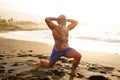 Happy fit senior man exercising on the beach during sunset time. In a healthy body healthy mind Royalty Free Stock Photo