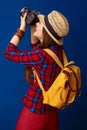 Happy fit tourist woman with modern DSLR camera taking photo Royalty Free Stock Photo
