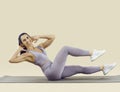 Happy fit woman doing bicycle crunches exercise during her fitness workout at the gym Royalty Free Stock Photo