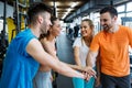 Happy fitness class giving high-five after completing exercise session