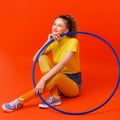 Happy fitness girl doing exercises with hula hoop Royalty Free Stock Photo