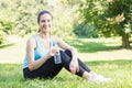 Happy fitness girl relaxing after exercising Royalty Free Stock Photo