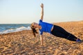 Fitness woman standing in side plank