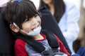 Happy five year old disabled boy in wheelchair Royalty Free Stock Photo