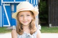 happy five years Girl playing outdoors headshot with straw hat Royalty Free Stock Photo