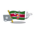 Happy flag suriname with the cartoon with bring laptop
