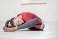 Happy flexible woman doing yoga exercises