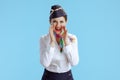 happy flight attendant woman on blue shouting Royalty Free Stock Photo