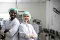 Happy food industry hygiene worker standing smile portrait together mix race man and woman caucasian and black african people Royalty Free Stock Photo