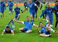 Happy football players celebrate qualifying to FIFA World Cup 2014