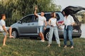 Happy Four Members Family Having Fun Time Outdoors, Mother Dancing with Teenage Daughter While Father Playing with Son Royalty Free Stock Photo