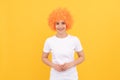 happy freaky woman in curly clown wig for party, fun Royalty Free Stock Photo