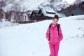 Happy free brunette woman enjoying winter vacations in front of