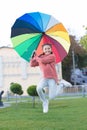 Happy and free. cheerful child. Spring style. Rainbow after rain. Little girl under colorful umbrella. Positive mood in Royalty Free Stock Photo