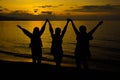 Happy and free Siluet people on sunset background, Silhouette three women with Raised Hands at Sunset Royalty Free Stock Photo