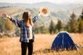 Happy freedom girl in straw hat with hands up in mountains travel Royalty Free Stock Photo