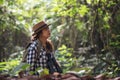 Happy freedom young woman watching wildlife with binoculars in nature park autumn, Tourist traveler backpack with copy space