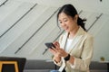 Happy freelance Asian woman. She can work anywhere, new frameless lifestyle Royalty Free Stock Photo