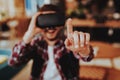 Happy Freelancer Finger Points while Testing VR