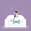 Happy freelancer girl with earphones on sofa with laptop. creative hipster work at home