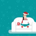 Happy freelancer girl with glasses and santa hat on sofa with laptop. creative hipster work at home.