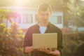 Happy freelancer surfer business man with laptop relaxing on the beach.freelance and remote work.happy male freelancing Royalty Free Stock Photo