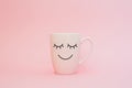 Happy friday word. Cup of coffee on pink background with smile face on mug. Concept about love and relationship. Royalty Free Stock Photo