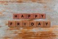 Happy Friday word written on wood block