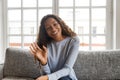 Happy friendly african american woman waving hand looking at cam Royalty Free Stock Photo