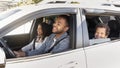 Happy friendly black family riding car traveling by automobile Royalty Free Stock Photo