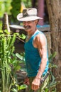 Happy and friendly Cuban senior cowboy and groom man capture portrait in old poor Trinidad, Cuba, America.