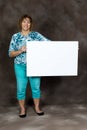 Happy or Friendly Middle-aged Woman Holding Blank Sign