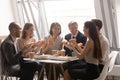 Happy friendly multi ethnic team having fun eating pizza together Royalty Free Stock Photo
