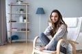 Happy friendly woman posing indoor at home in casual clothes