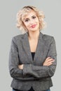 Happy friendly woman smiling and standing with crossed arms portrait. Smart businesswoman in suit portrait Royalty Free Stock Photo