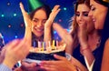 Happy friends birthday party with candle celebration cakes. Royalty Free Stock Photo