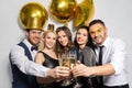 Happy friends clinking champagne glasses at party Royalty Free Stock Photo