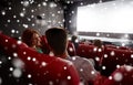 Happy friends or couple watching movie in theater Royalty Free Stock Photo
