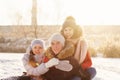 Group of teenage friends having fun snow in winter Royalty Free Stock Photo