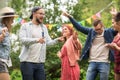 Happy friends dancing at summer party in garden Royalty Free Stock Photo