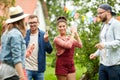 Happy friends dancing at summer party in garden Royalty Free Stock Photo