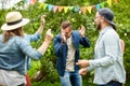 Happy friends dancing at summer party in garden Royalty Free Stock Photo