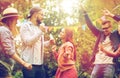 Happy friends dancing at summer party in garden Royalty Free Stock Photo