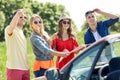 Happy friends driving in cabriolet car Royalty Free Stock Photo