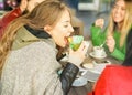 Happy friends eating breakfast and drinking coffee cappuccino at bar restaurant - Young people having fun - Friendship and work Royalty Free Stock Photo