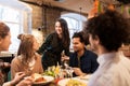 Happy friends eating and drinking at restaurant Royalty Free Stock Photo