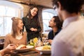 Happy friends eating and drinking at restaurant Royalty Free Stock Photo