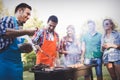 Happy friends enjoying barbecue party Royalty Free Stock Photo