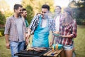 Happy friends enjoying barbecue party Royalty Free Stock Photo